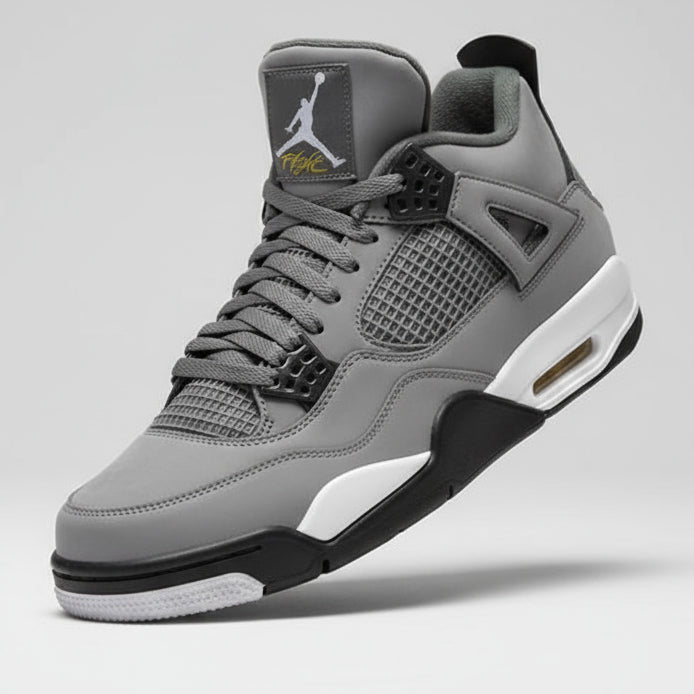 Gray sneaker with black accents worn by a person, blurred background