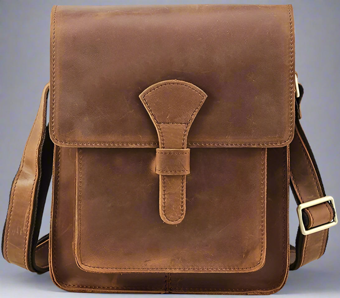 Brown leather satchel bag on a white background