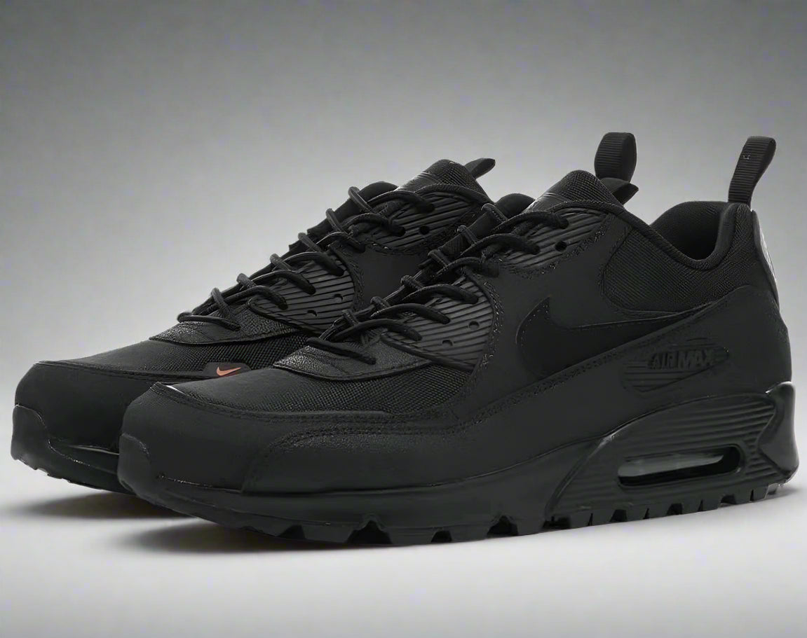 Black Nike sneakers on a white background