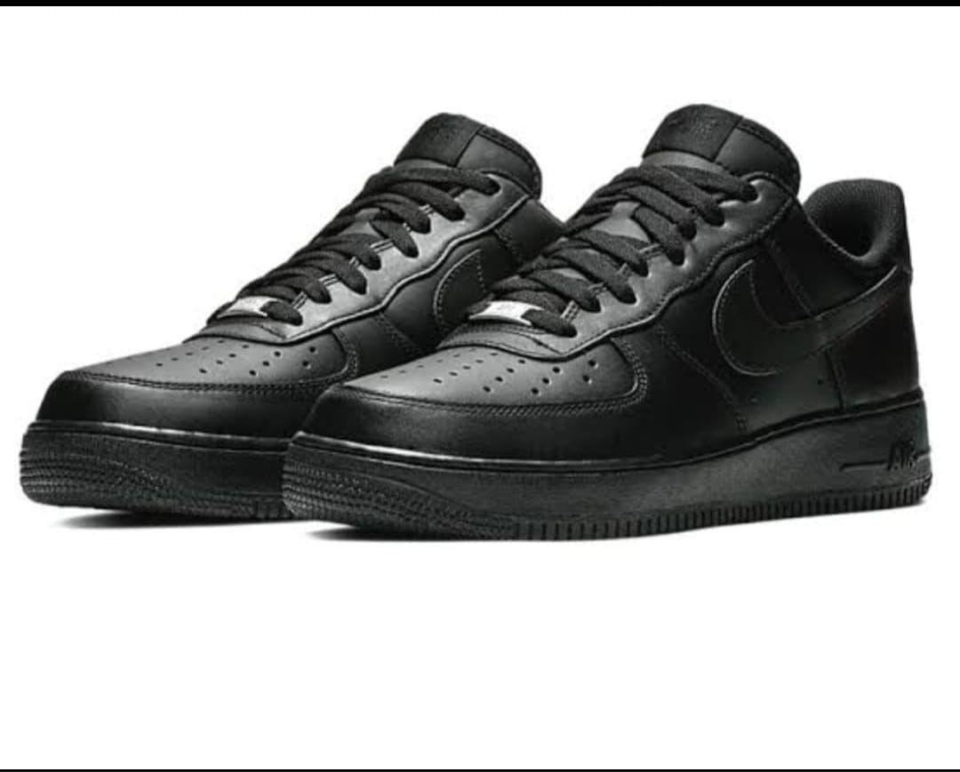 Nike Air Force 1 – Classic All-White or All-Black Sneakers.