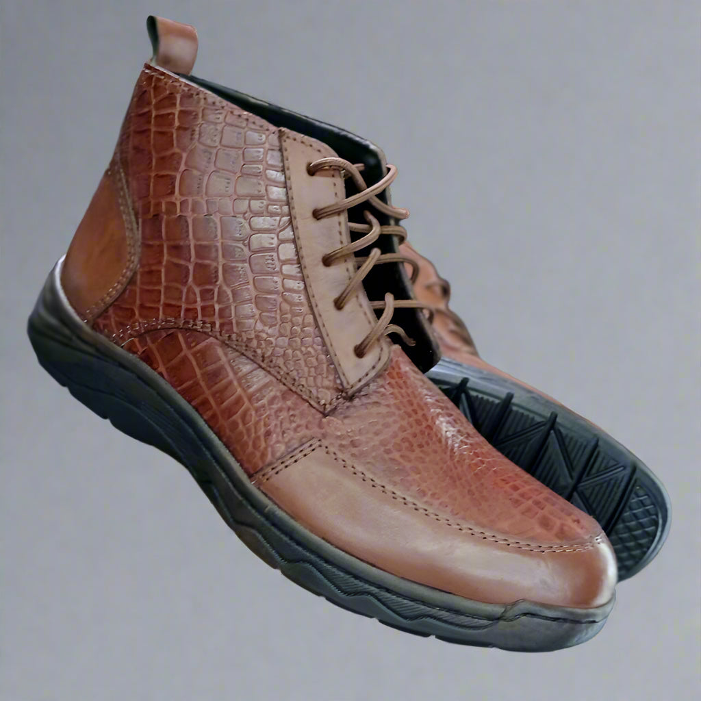 Brown leather shoe with black sole held by a person against a blurred shoe store background