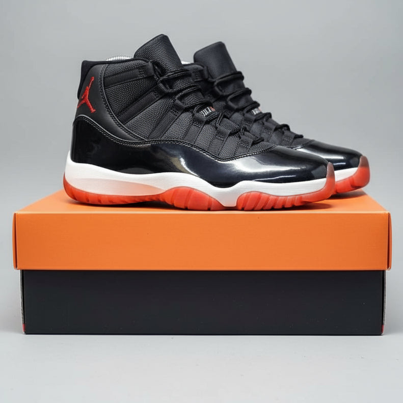 Black and red high-top sneakers on a Nike box with a blurred background