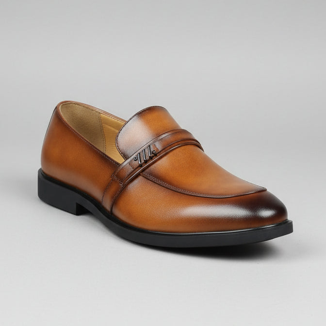 Brown leather shoe with a price tag held by a hand against a background of shoes and boxes.