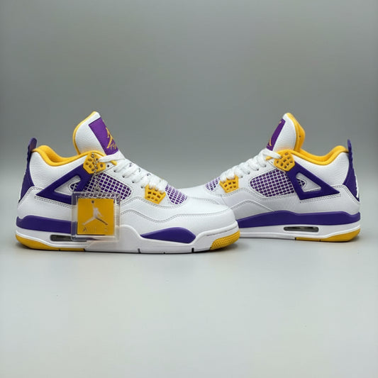White sneakers with purple and yellow accents on a white surface.