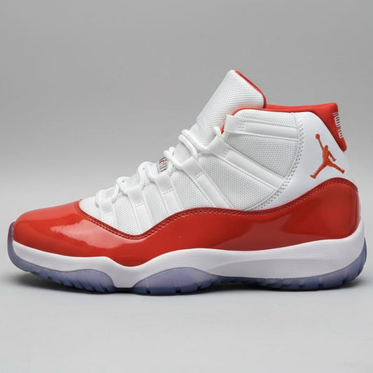 Red and white sneaker with a brand logo held by a hand against a blurred background