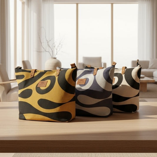 Three patterned bags on a wooden surface with a blurred background