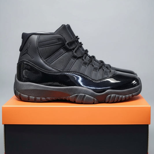 Black high-top sneakers on an orange Nike box with a blurred background