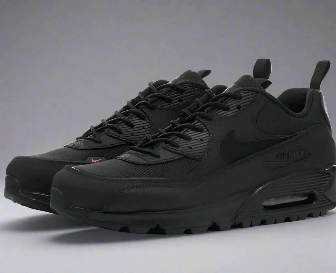Black Nike sneakers on a white background