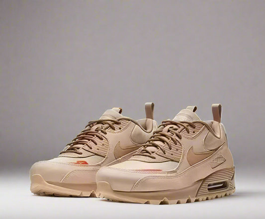 Beige sneakers with a Nike logo on a white background