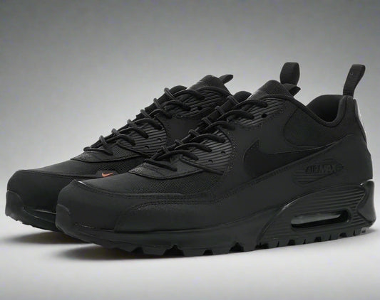 Black Nike sneakers on a white background