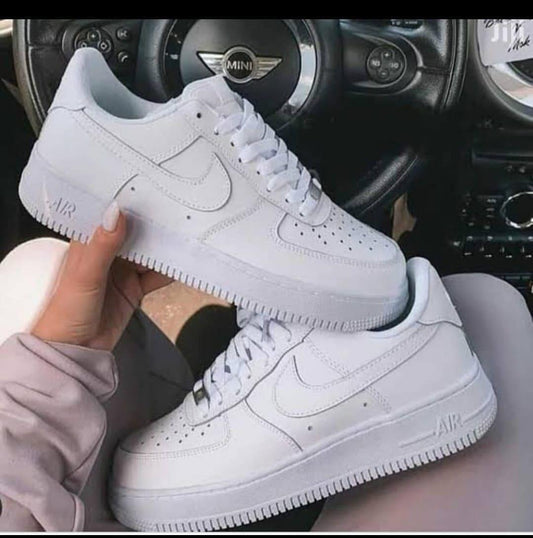 Nike Air Force 1 – Classic All-White or All-Black Sneakers.