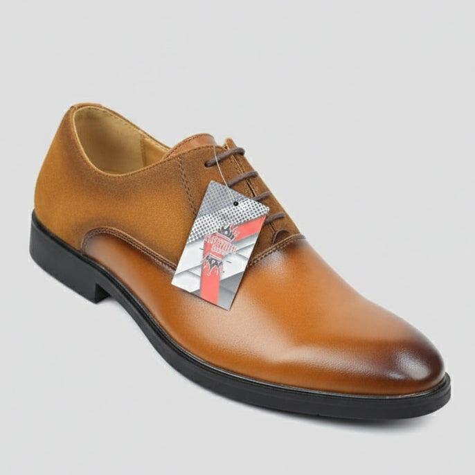 Brown leather shoe held by a hand with a blurred store background