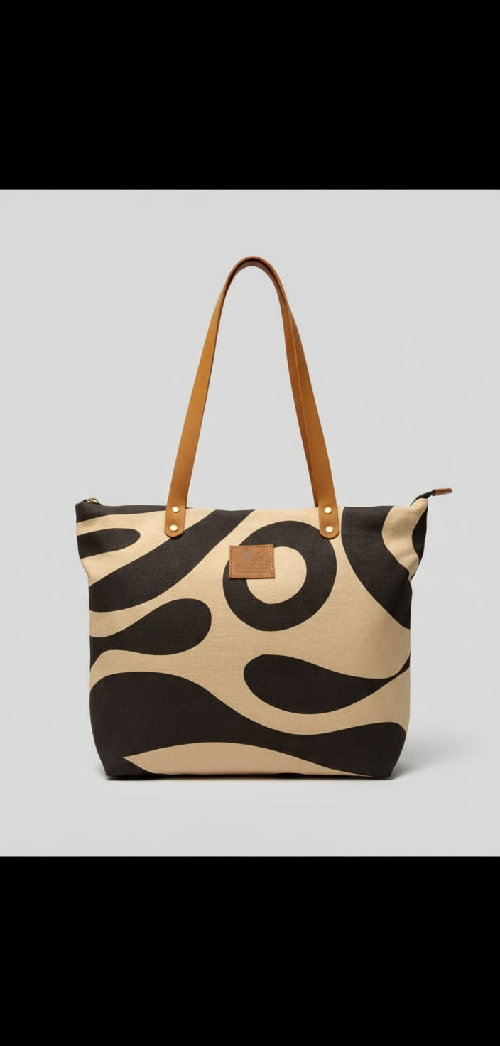 Patterned handbag with gold accents on a chair