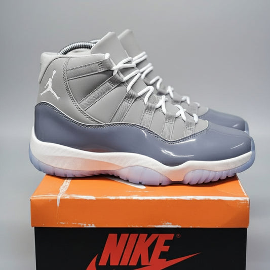 Gray high-top sneakers on a Nike box with a blurred background